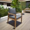 Ghế sân vườn khung gỗ teak, nệm xám đậm, tựa dây rope, đặt ngoài trời sang trọng