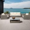 Bộ sofa sân vườn 4 món giả mây xám, nệm kem, bàn kính, đặt ngoài trời view biển sang trọng