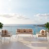 Bộ sofa sân vườn nhôm trắng 4 món, nệm be, đặt ngoài trời view biển sang trọng
