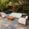 Bộ sofa sân vườn gỗ teak 4 món, nệm màu ghi sáng, phong cách hiện đại, đặt ngoài trời sang trọng