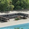 Bộ sofa góc L ngoài trời khung gỗ teak, nệm xám đậm, đặt cạnh hồ bơi sang trọng