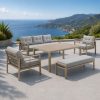 Bộ sofa sân vườn nhôm sơn tĩnh điện màu be, nệm ghi, đặt ngoài trời view biển sang trọng