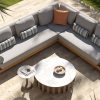 Bộ sofa sân vườn góc L hiện đại với nệm ghi sáng và bàn trà mặt đá sang trọng ngoài trời