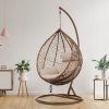 Ghế xích đu tổ chim ngoài trời khung sắt giả mây, nệm kem, đặt trong phòng khách hiện đại