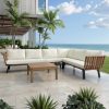 Bộ sofa sân vườn góc L hiện đại, nệm kem, bàn trà gỗ, view biển sang trọng