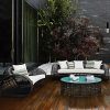 Bộ sofa sân vườn hiện đại gồm sofa dài, ghế đơn, bàn trà kính, nệm trắng, phù hợp không gian ngoài trời.
